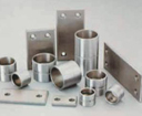 Metal backed FeNi powder with solid lubricants